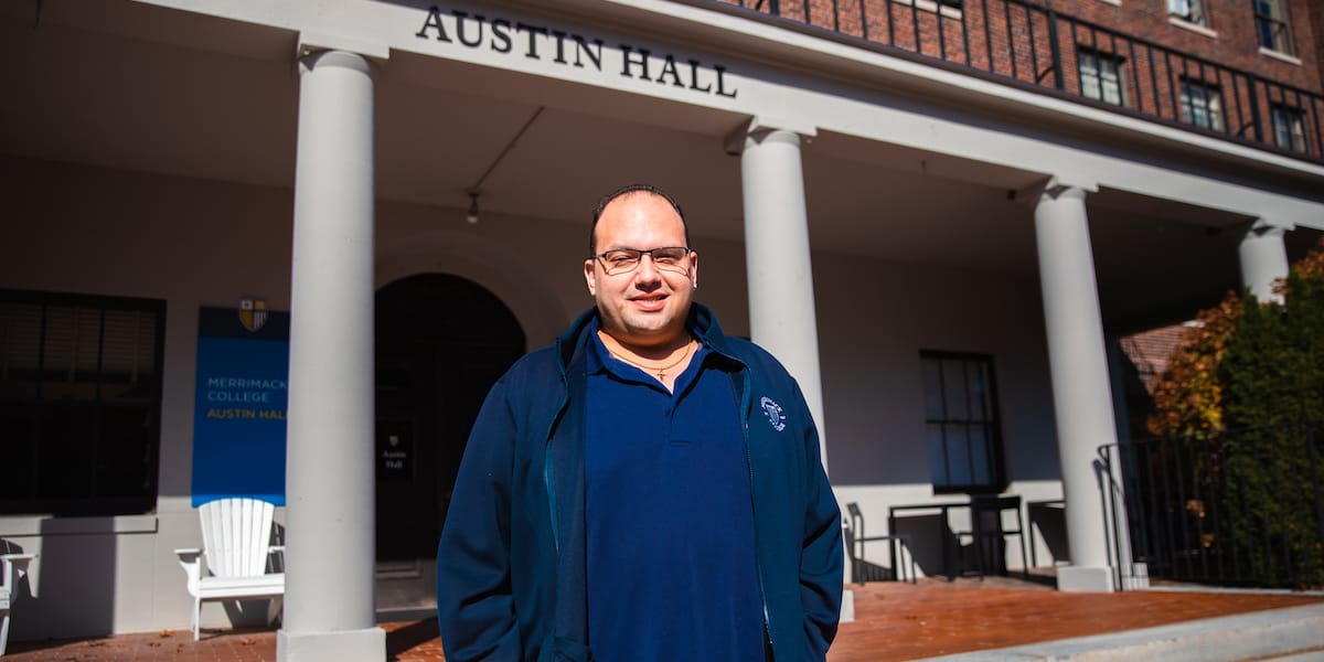 Photo of Andrew Butz standing outside Austin Hall.