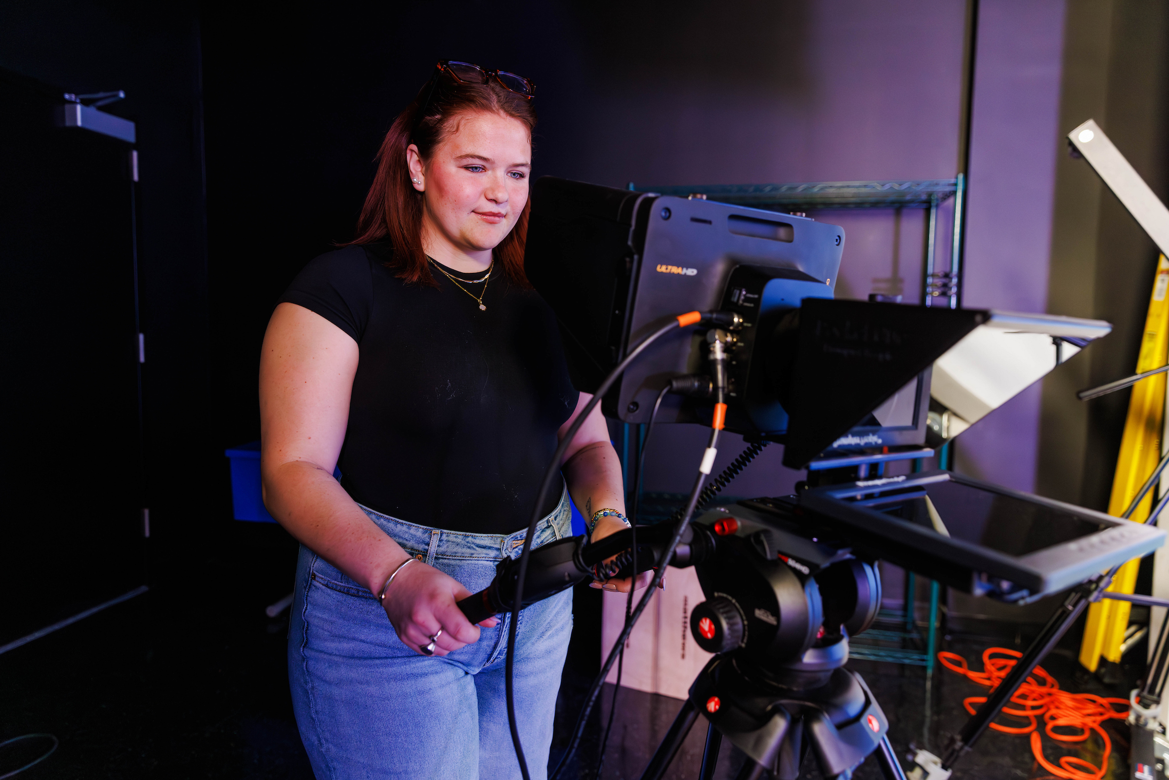 Student operating a camera