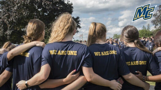 Students wearing we are one shirts.