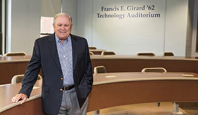Francis Girard standing in the Girard Technology Auditorium
