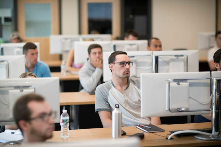 Students in class in front of computer lab in Crowe Hall