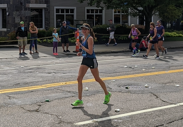 Photo of Lisa Perks running the 2021 Boston Marathon.