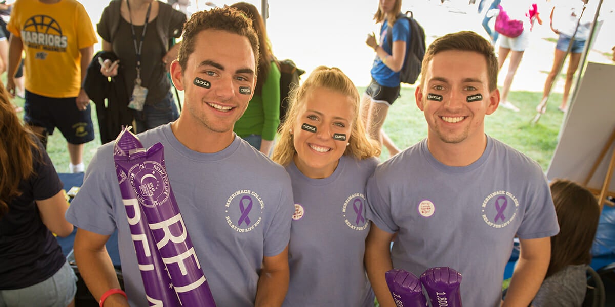 Three Merrimack students at a Relay for Life event.