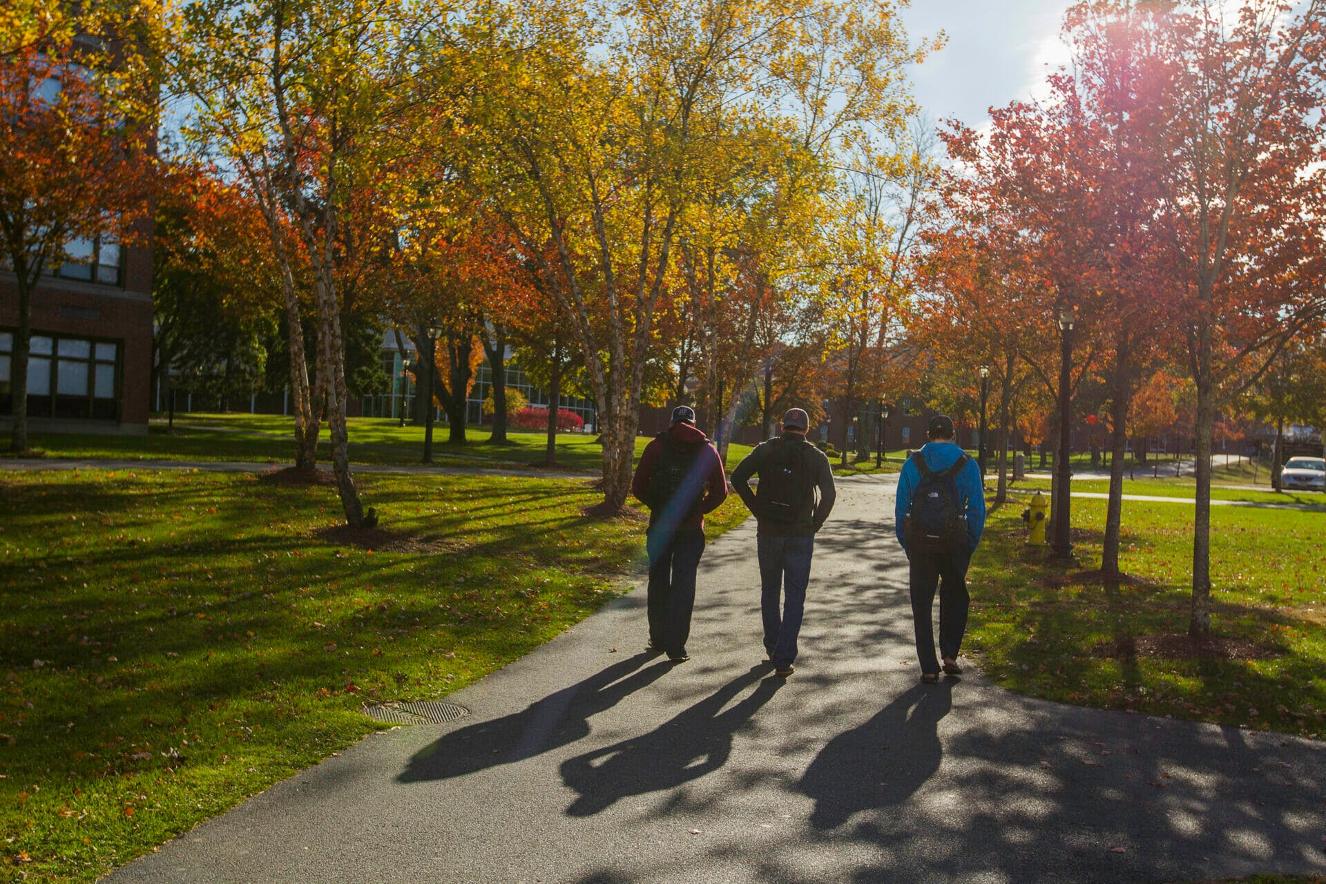 Students walking on fall day at Merrimack