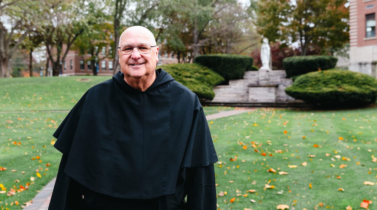 Photo of Fr. Raymond Dlugos, O.S.A. standing outdoors.