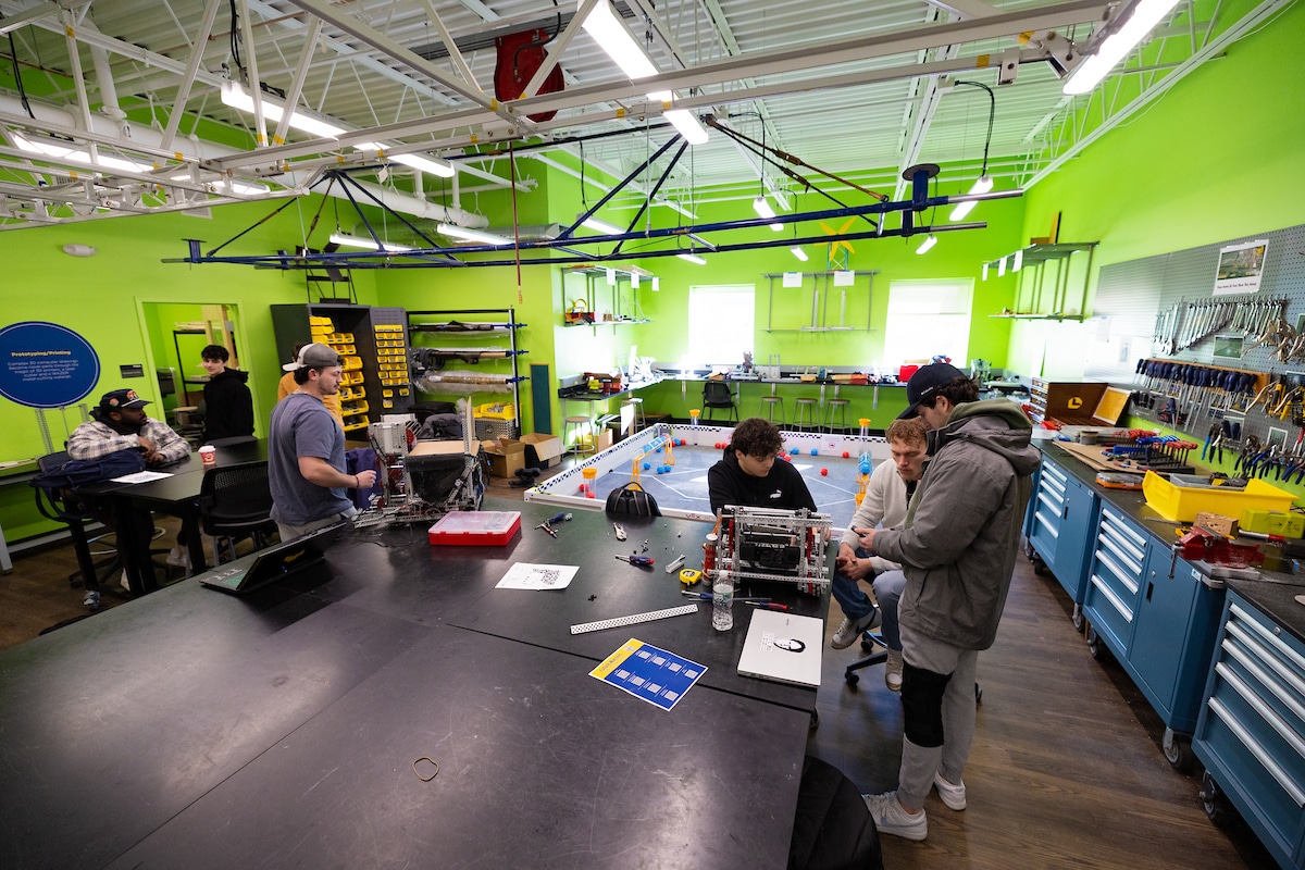 Students working at a table in engineering lab