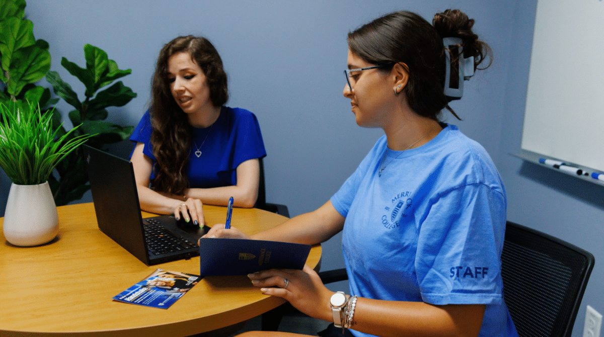 Counselor's looking at a laptop