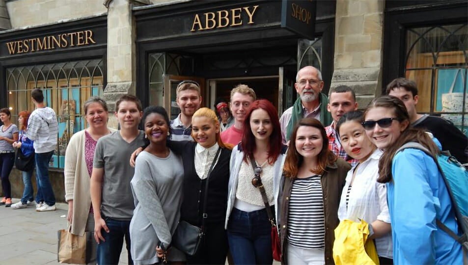 Students standing in front of Westminster Abbey shop in England