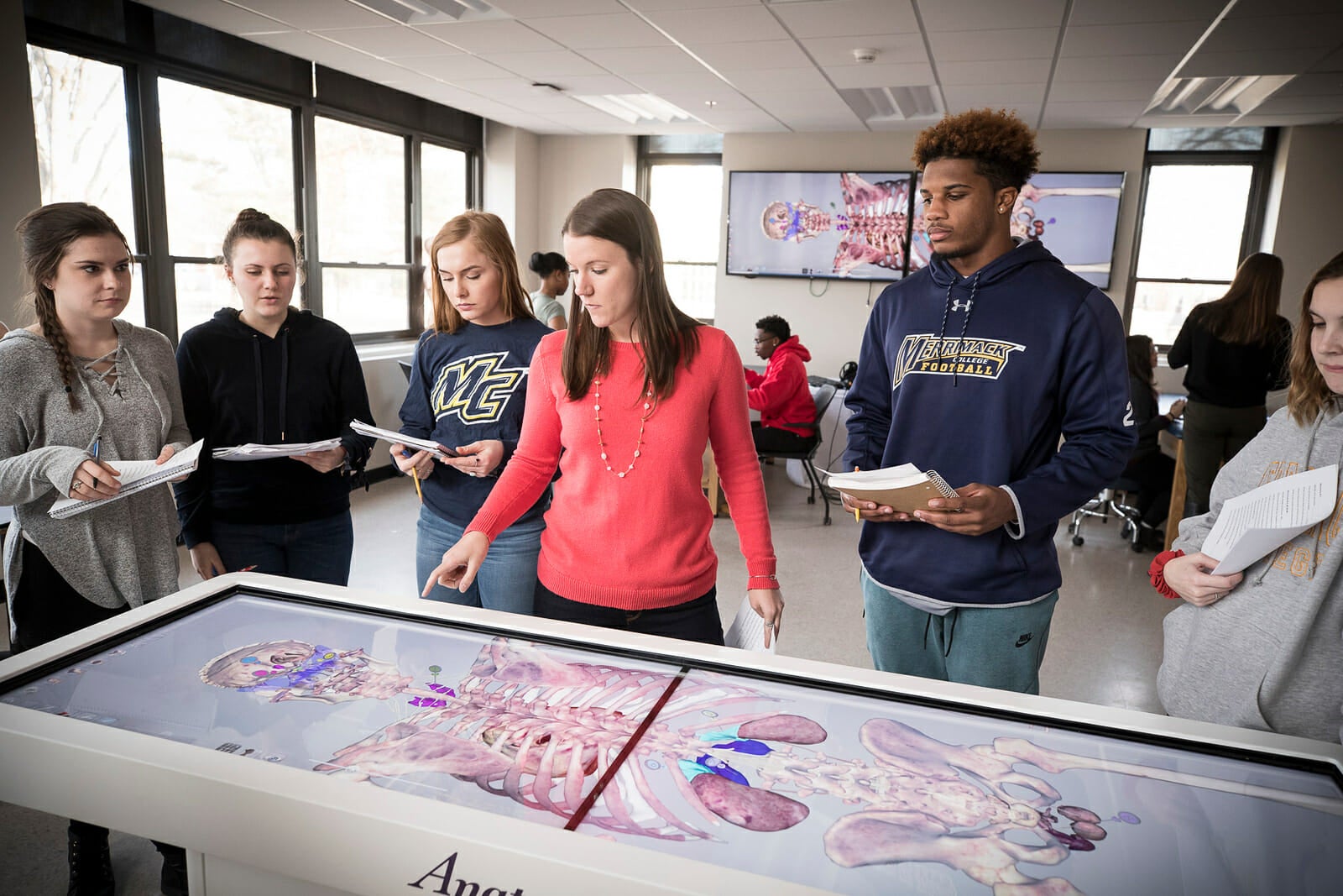 Students gathered around Anatomage Table
