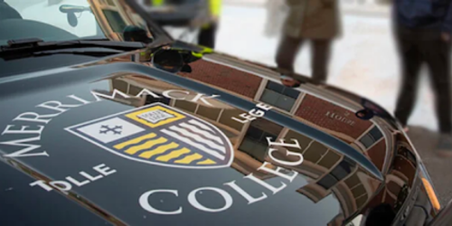 Photo of the hood of a Merrimack College Police Department cruiser.