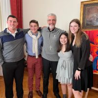 Four Merrimack Austin Scholars pose with