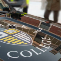 Photo of the hood of a Merrimack College Police Department cruiser.