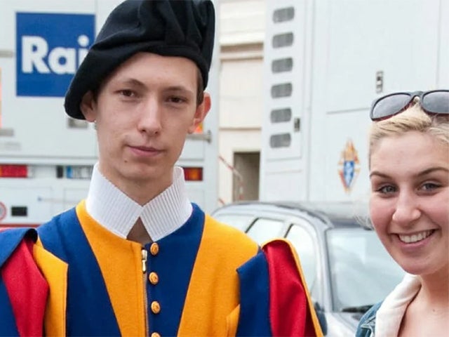 Student standing with Swiss Guard