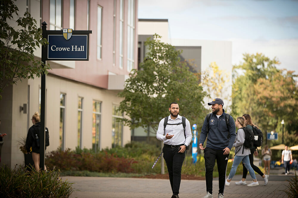 Students walking in front of Crowe Hall