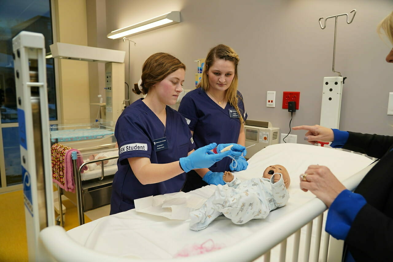 Nursing Students with Baby Manikin